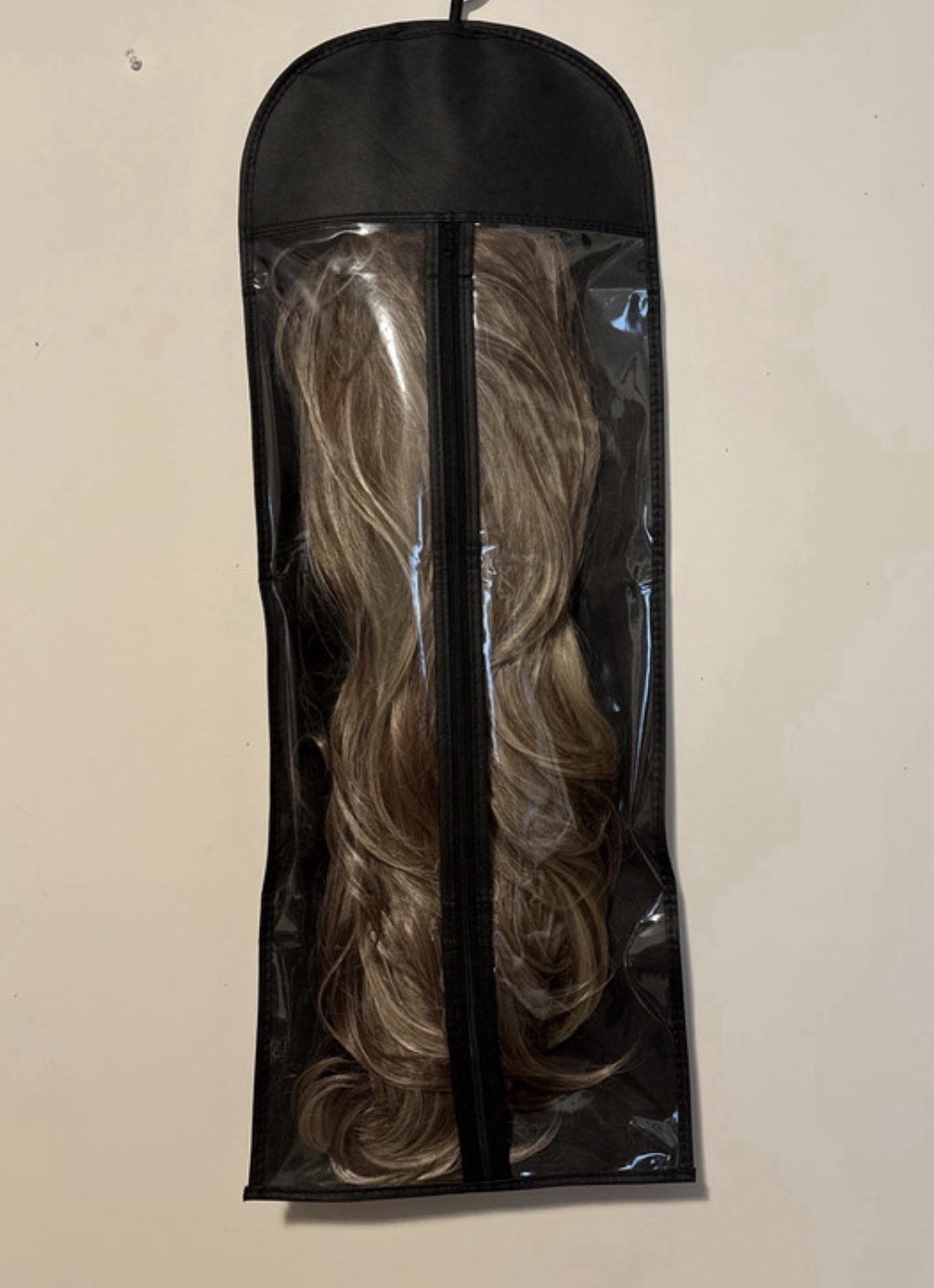 Lady Grayy long, wavy blonde synthetic wig with brown highlights. 26-28”