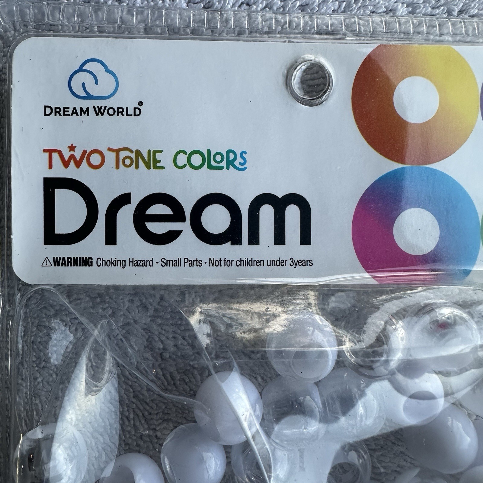 Dream World white and clear plastic hair beads include a small beader tool