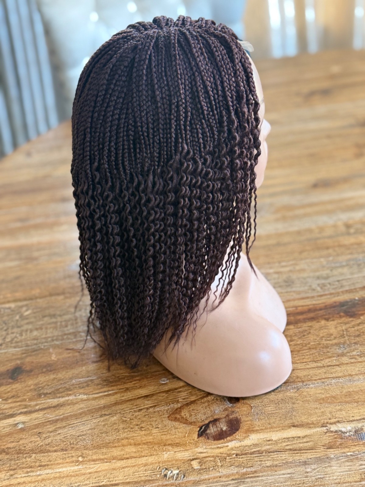 braided curly wg. It’s made on a closure. Brown watermelon shorty 12”wig