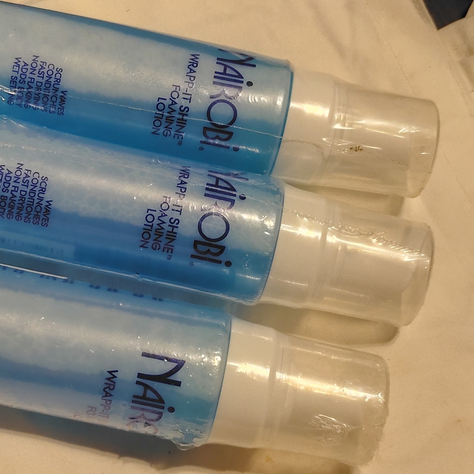 Nairobi wrapp-it shine loaming lotion 3 bottles 8oz each
