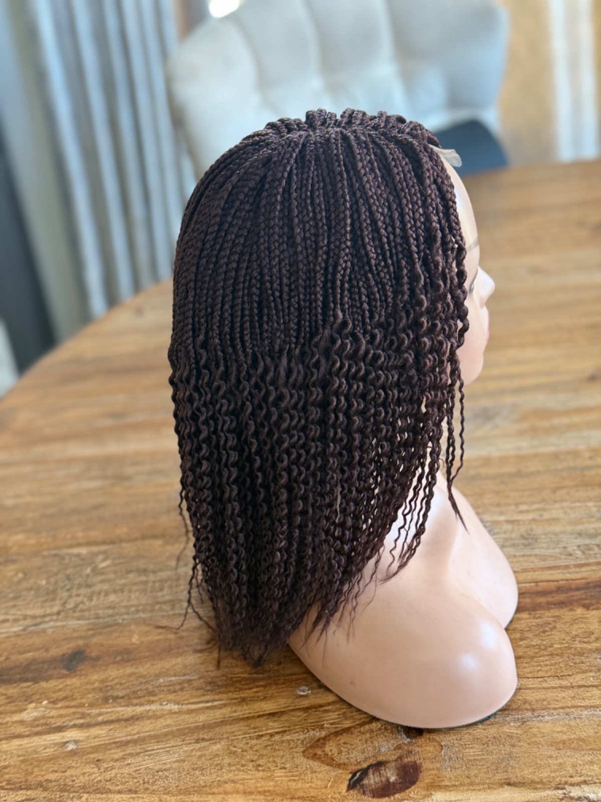 braided curly wg. It’s made on a closure. Brown watermelon shorty 12”wig