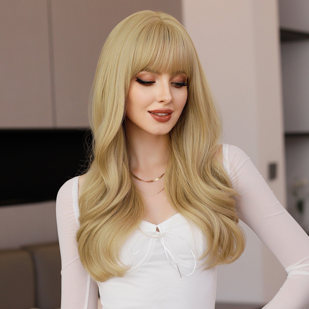 The lady has naturally long golden hair and is wearing a synthetic blonde wig