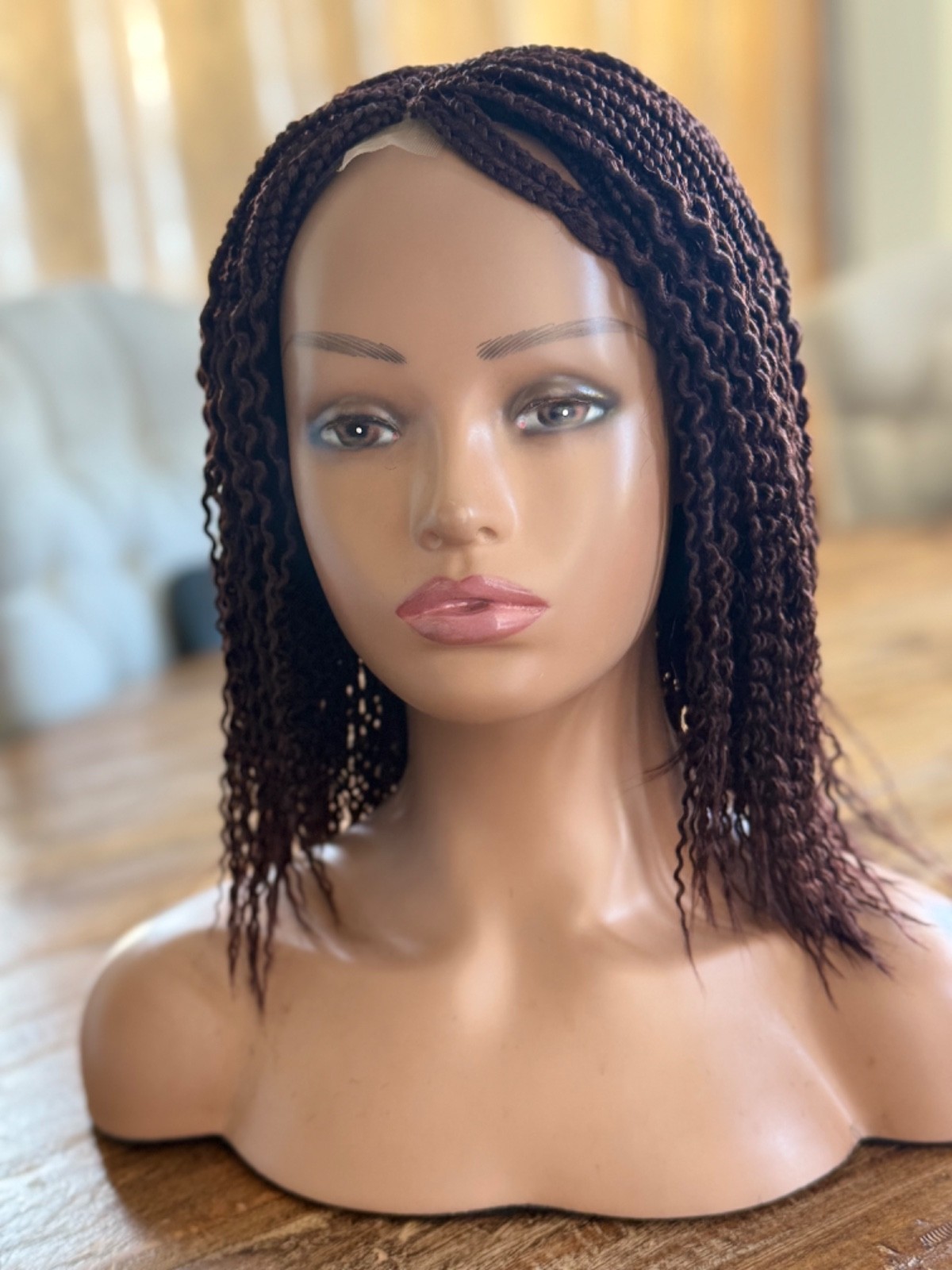 braided curly wg. It’s made on a closure. Brown watermelon shorty 12”wig