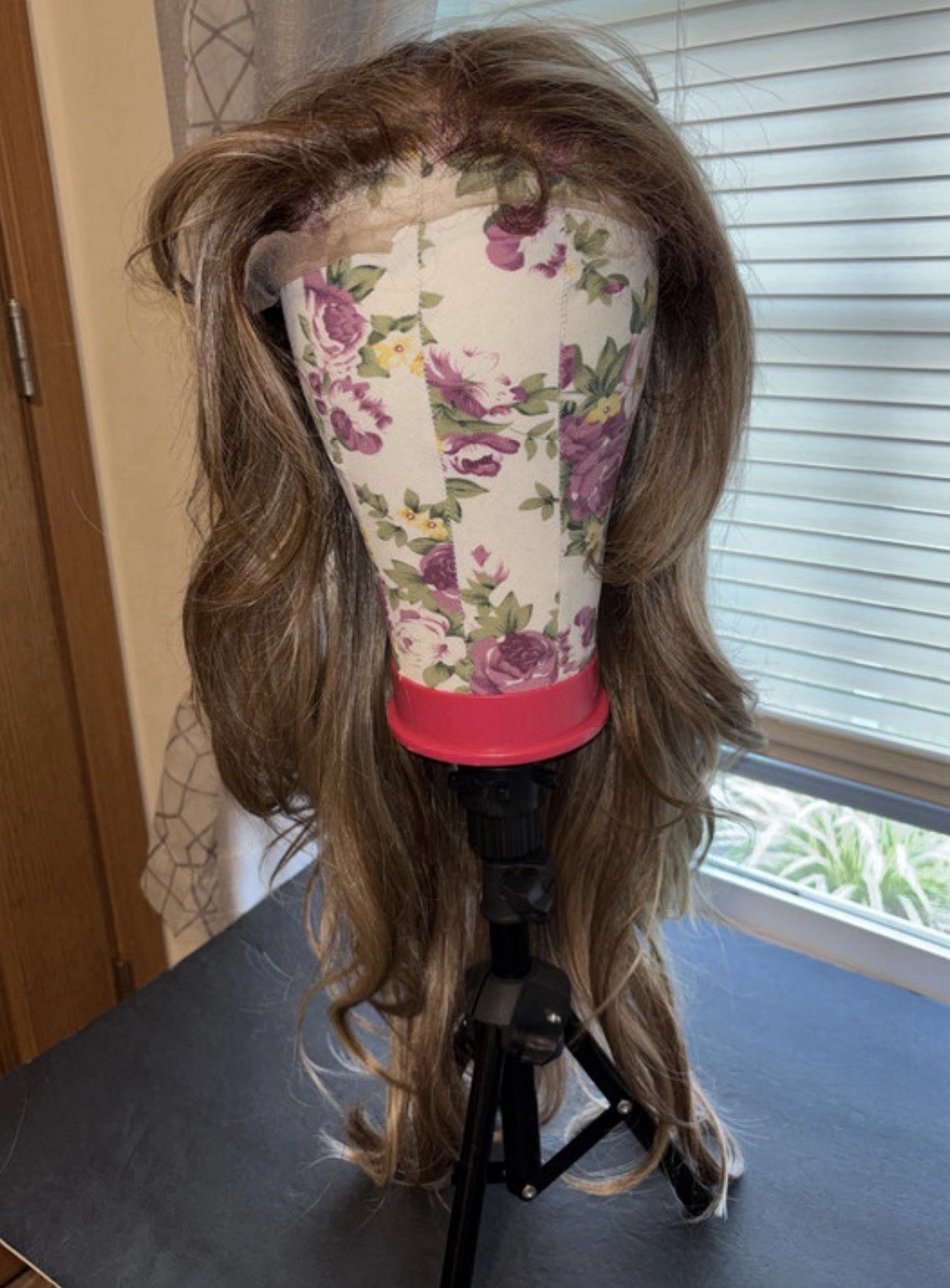 Lady Grayy long, wavy blonde synthetic wig with brown highlights. 26-28”